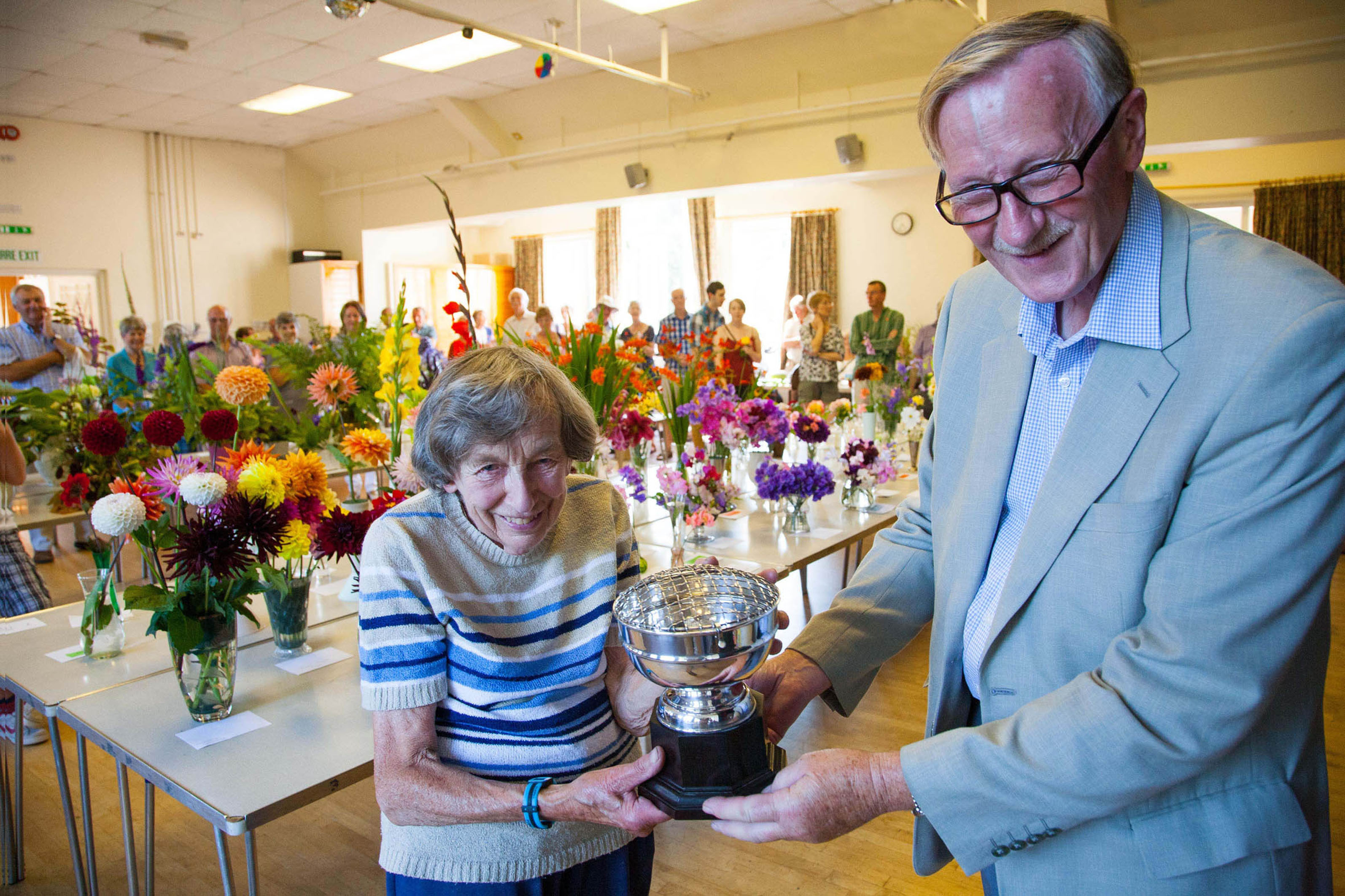 Cynthia Bussey being presented, at the 2015 show, with the Old Court Nursery Rose Bowl for her perennial flower display